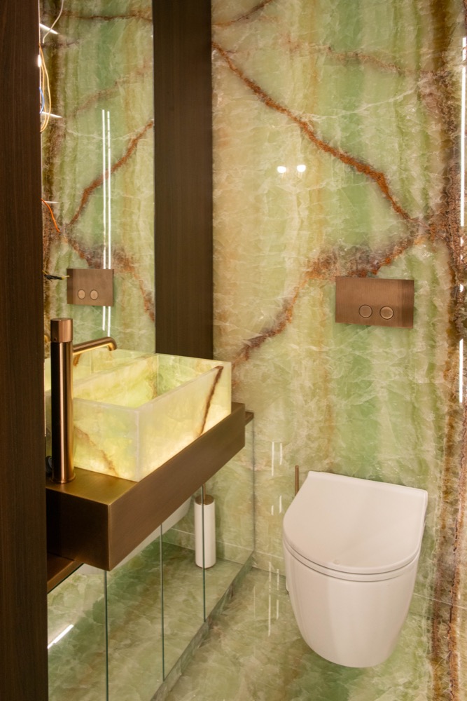 Powder room with a backlit basin